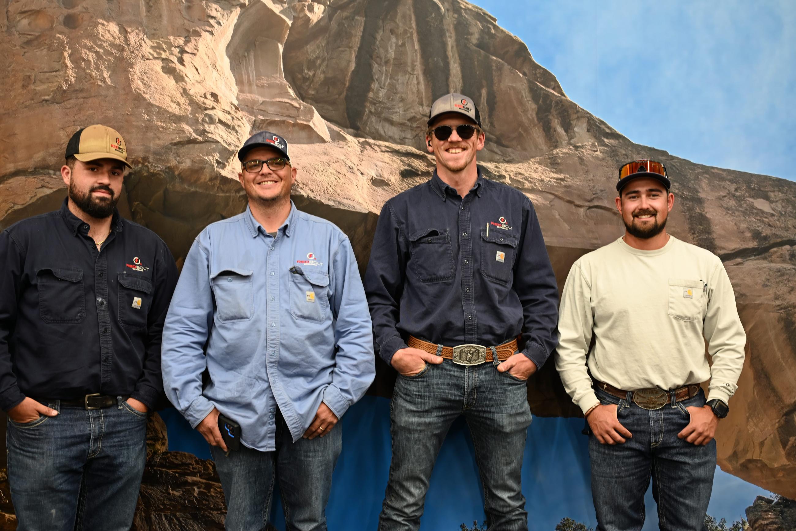 Four employees side by side, Joshua Willcox, Adam Newberry, Isiah Wahl, Roman Carpenter