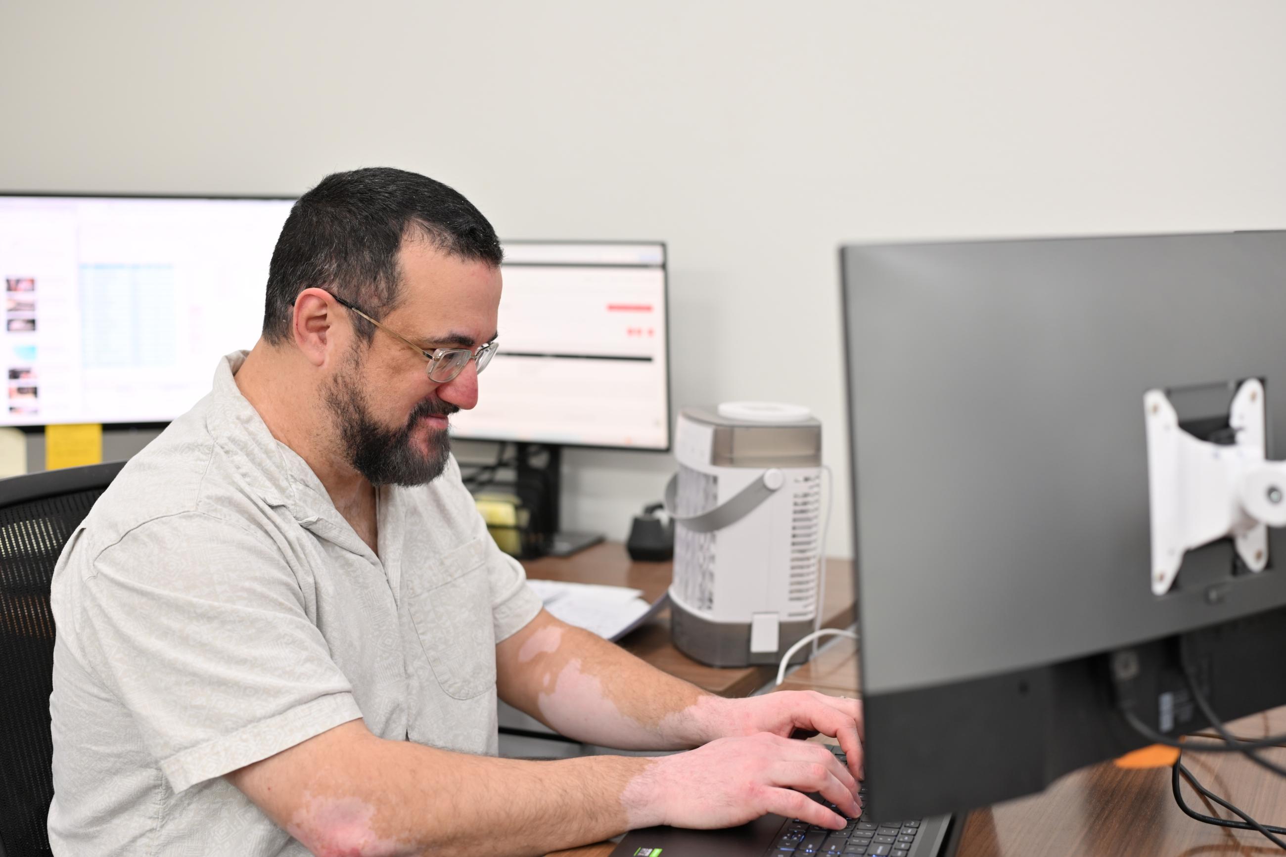 IT Support at their keyboard typing